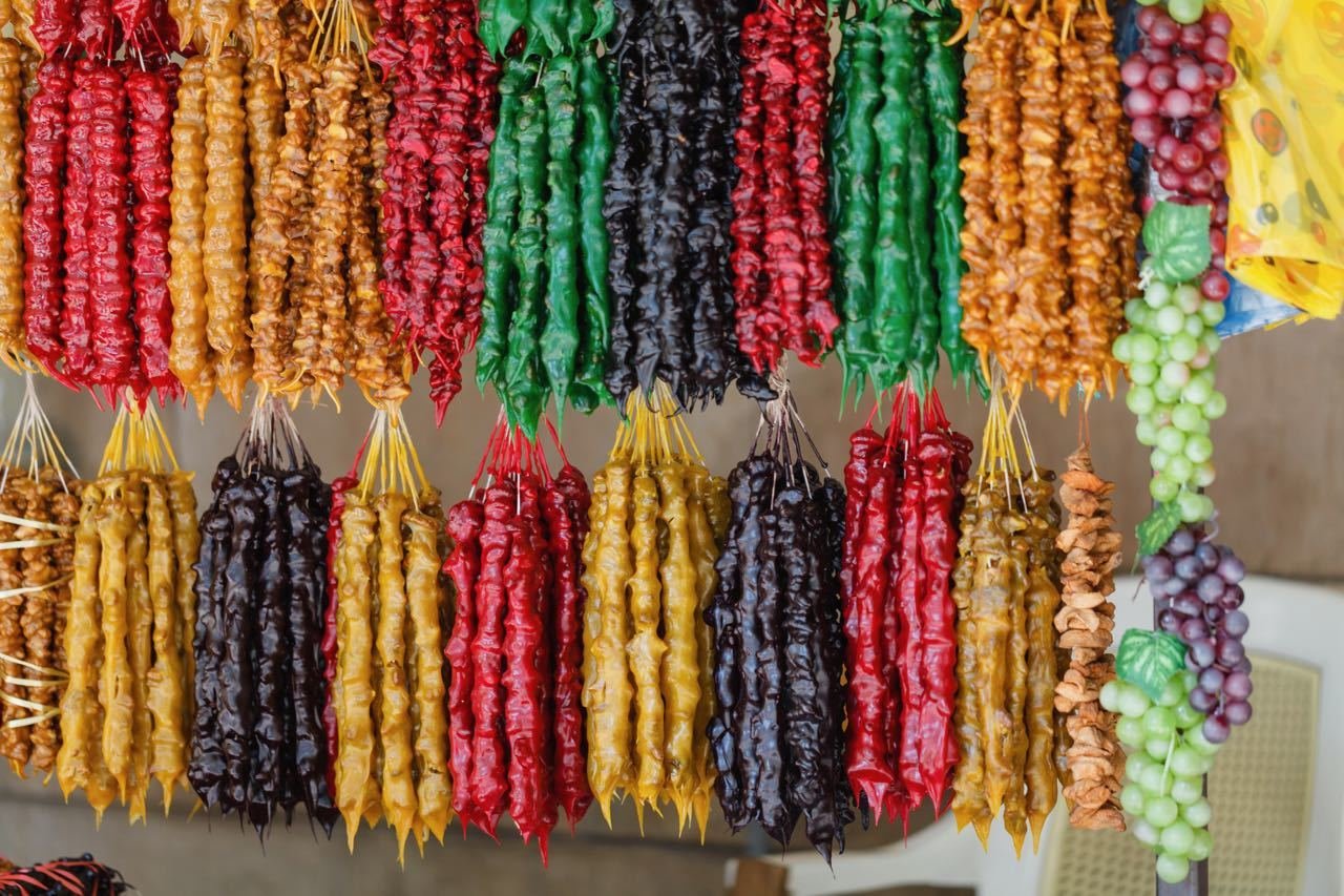 Top Things To Do In Tbilisi, Georgia - street stall with typical Georgian candy - Churchkhela and Georgian spices