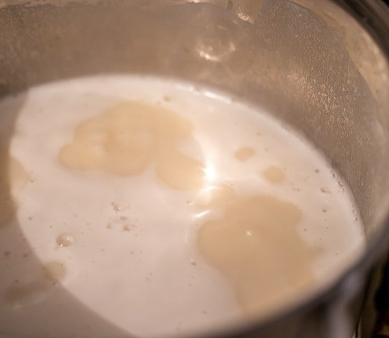 Tort Wafers Cake with Milk simmering on a stove top.