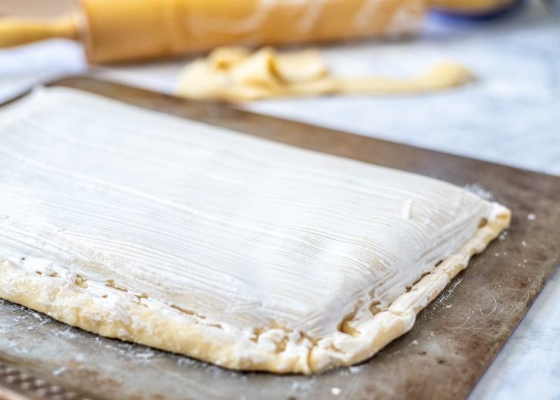 A Rudarska Greblica, a Croatian recipe, is a delectable pastry with icing that is baked on a sheet.