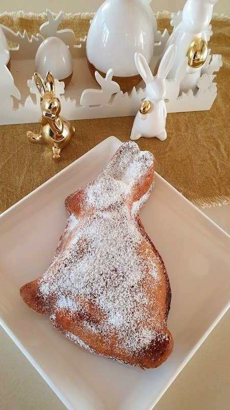 A white plate with a powdered Croatian Kuglof bunny on it.