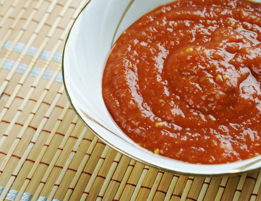 Zacusca - vegetable spread popular in Romania. ingredients are roasted eggplant, sauteed onions, tomato paste, and roasted red peppers