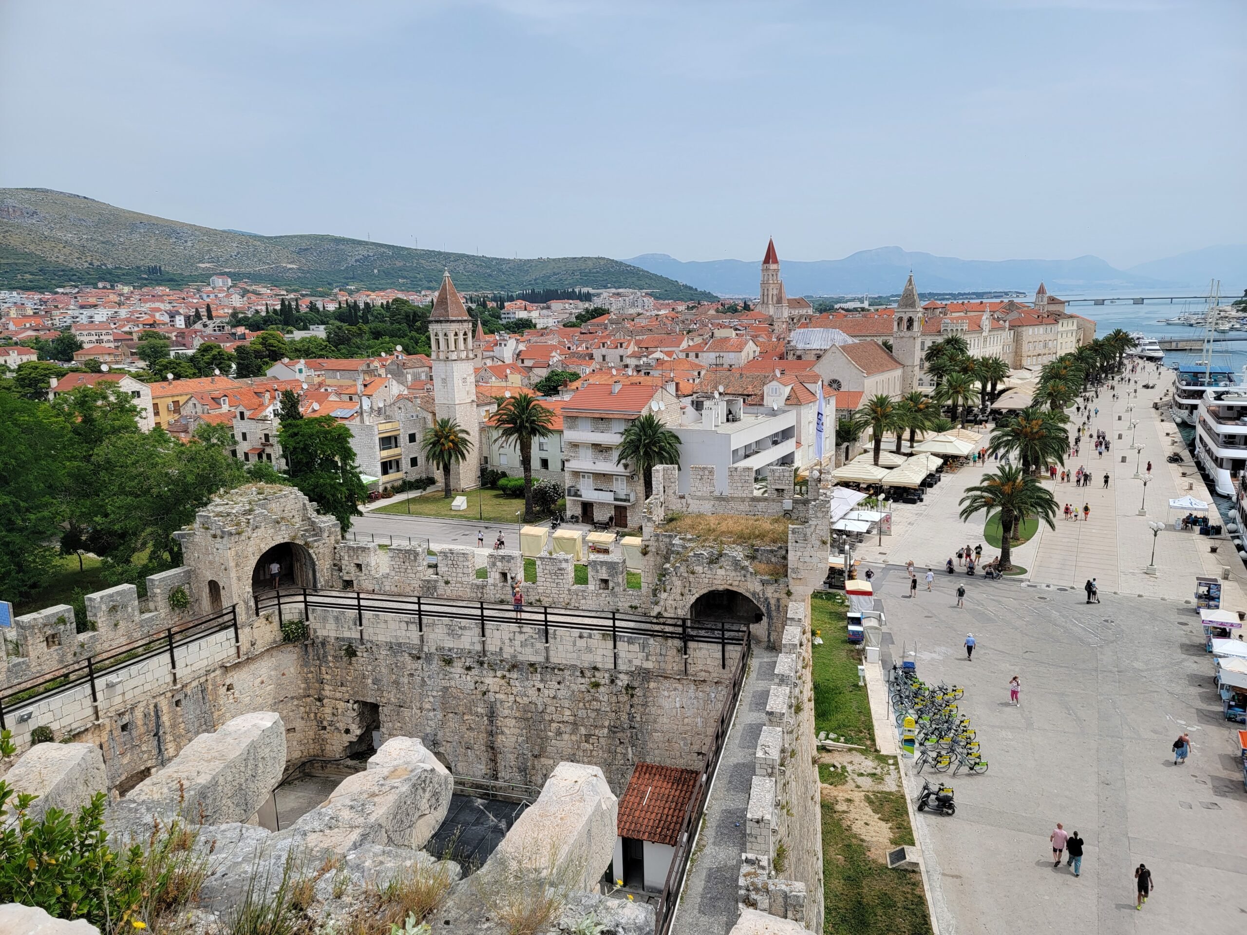 A breathtaking view of Croatia's cityscape of Trogir in spring, as seen from the top of a historic wall.