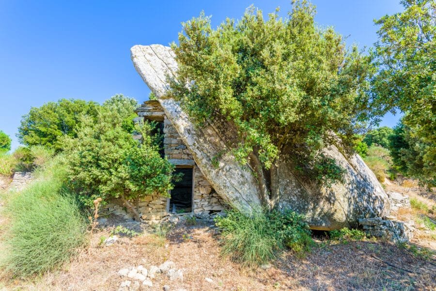 Ancient,Traditional,Stone,House,Ruin,Built,Under,A,Boulder,On