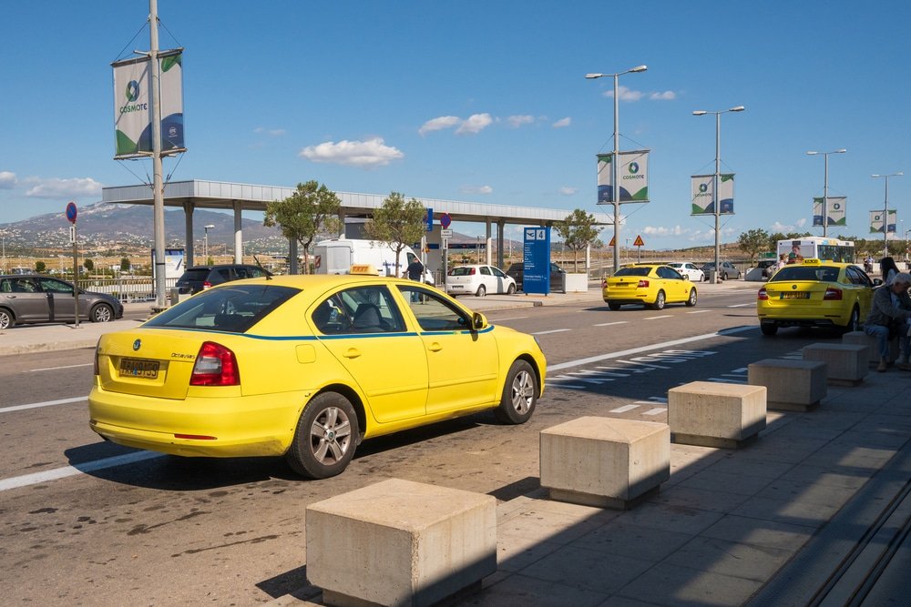Athens Airport To The Acropolis, Athens - Yellow taxi at Athens International Airport