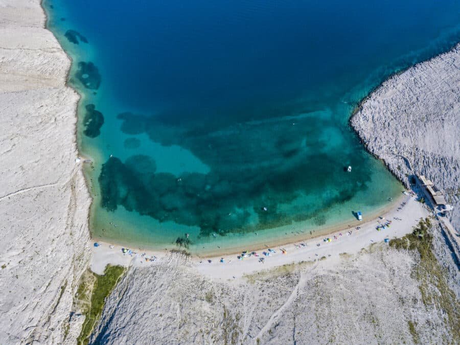 Aerial view of Rucica beach on Pag island, Metajna, Croatia._Depositphotos_205486858_S