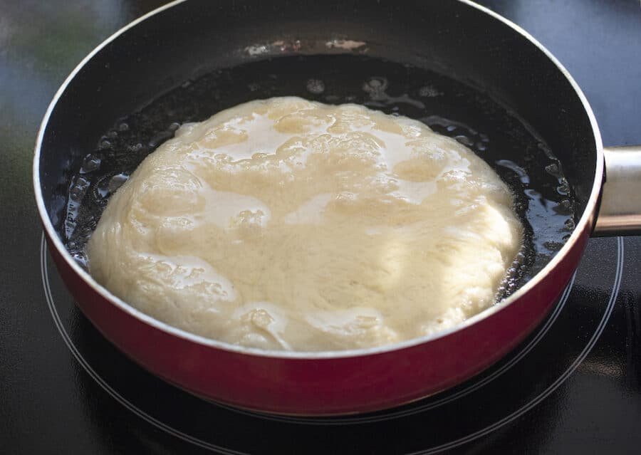 A Bulgarian frying pan with a Mekitsi Recipe dough in it.