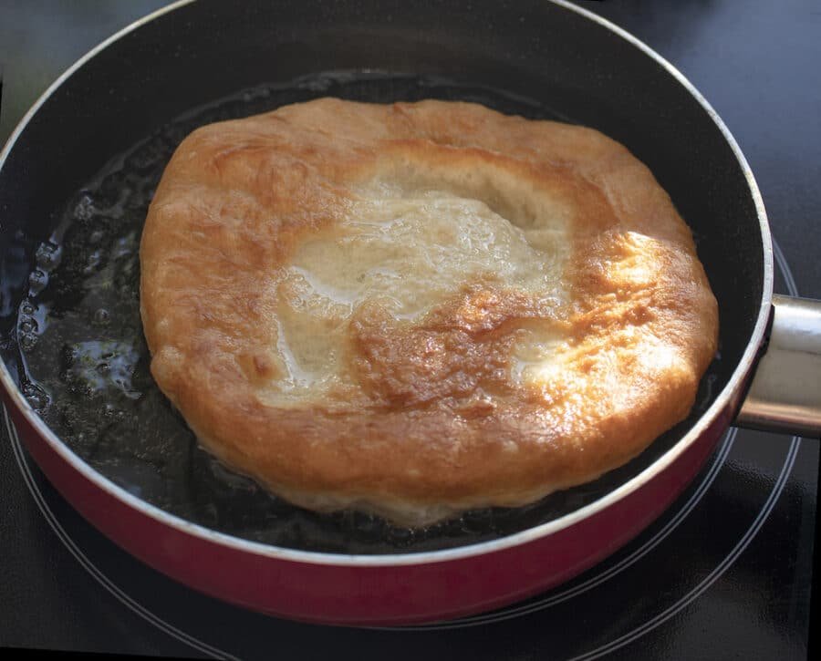 A Bulgarian frying pan with a Mekitsi Recipe in it.