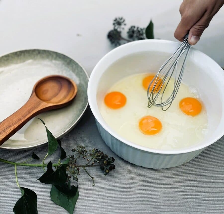Whisked eggs in a bowl, ready for a delightful recipe.