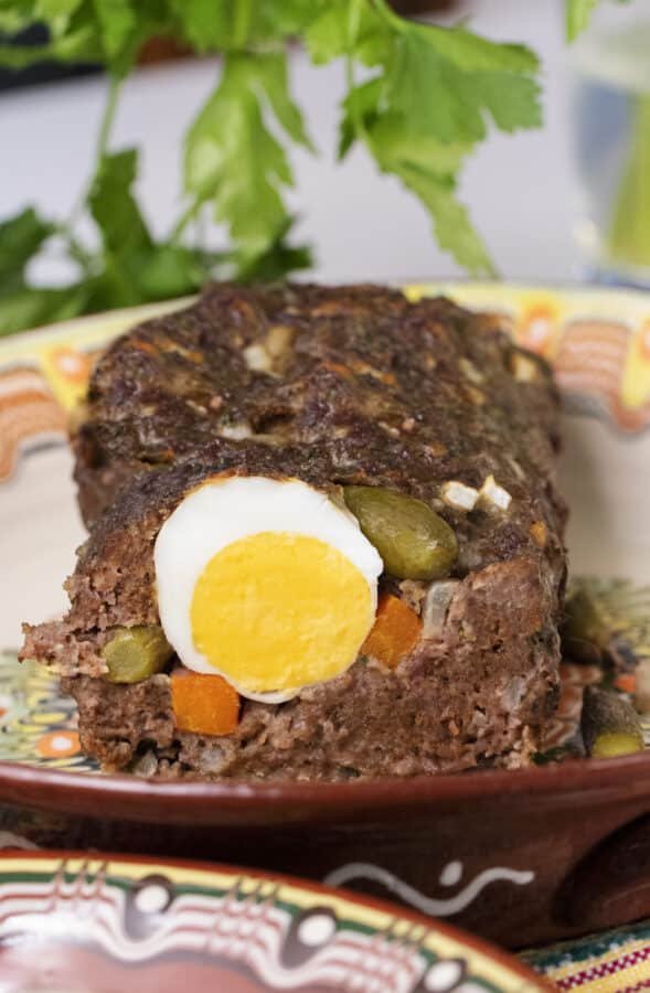 Rulo Stefani's Mexican meatloaf topped with a perfectly cooked egg on a plate.