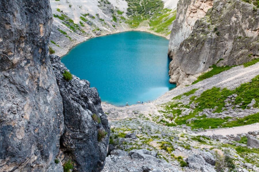 Imotski, Croatia boasts a stunning blue lake nestled in the heart of a rocky mountain.