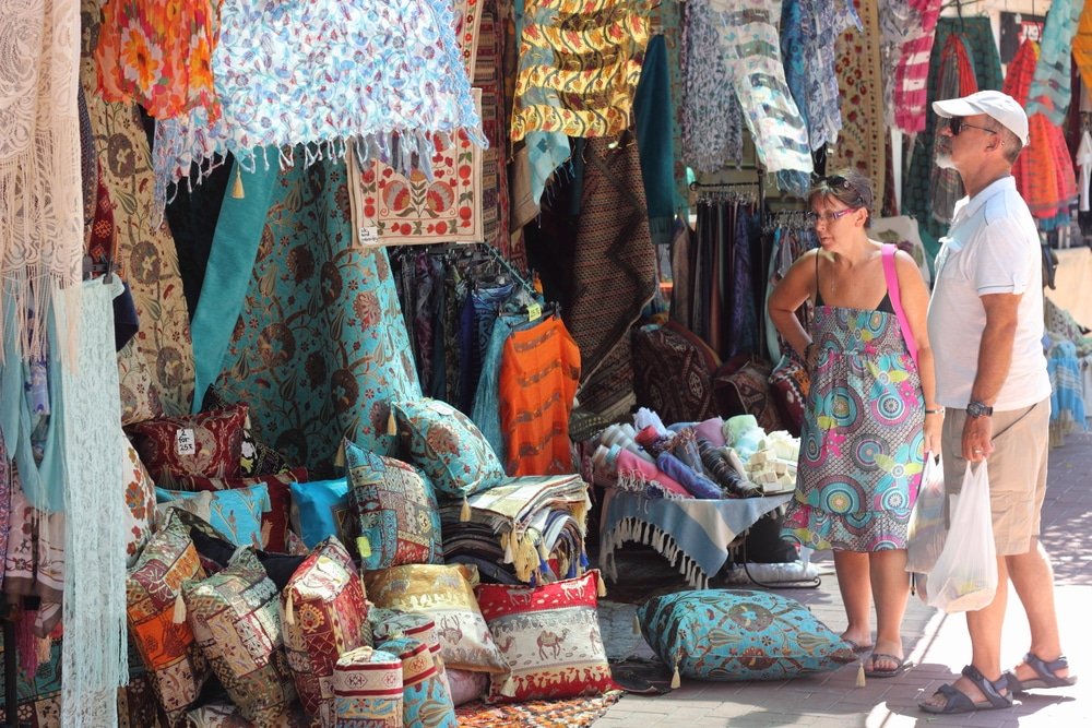 Things to do in Fethiye - Fabrics, textiles and Turkish rugs for sale at the local bazaar in Fethiye