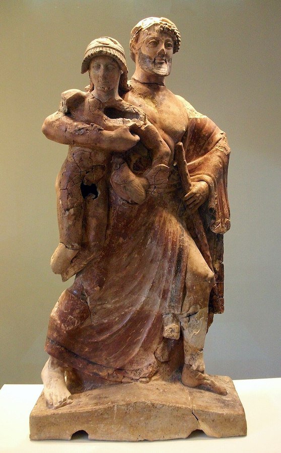 A famous statue of a man holding a child, reminiscent of Greek statues.