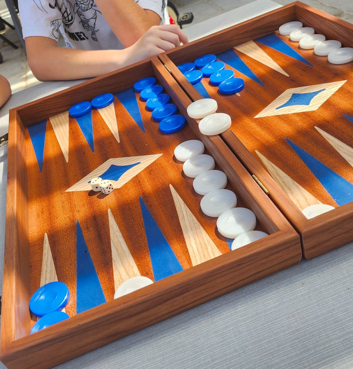 Get a traditional Greek wooden backgammon board as a souvenir from Greece.