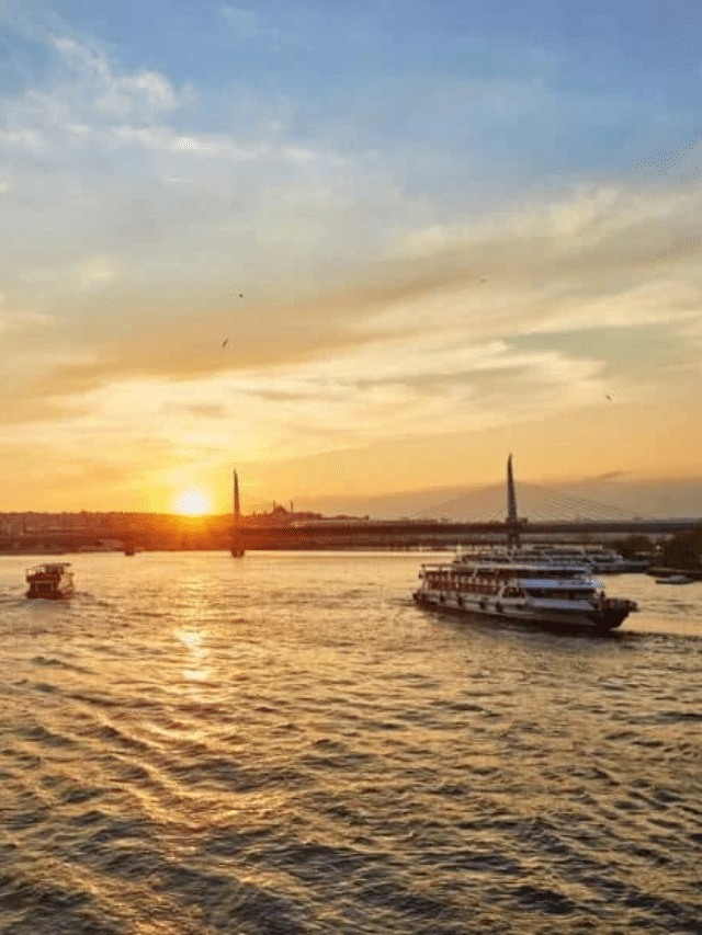 Experience the enchanting beauty of Istanbul as the sun sets over the Bosphorus River, glistening against a backdrop of charming boats. Discover the mesmerizing sights and sounds on a memorable