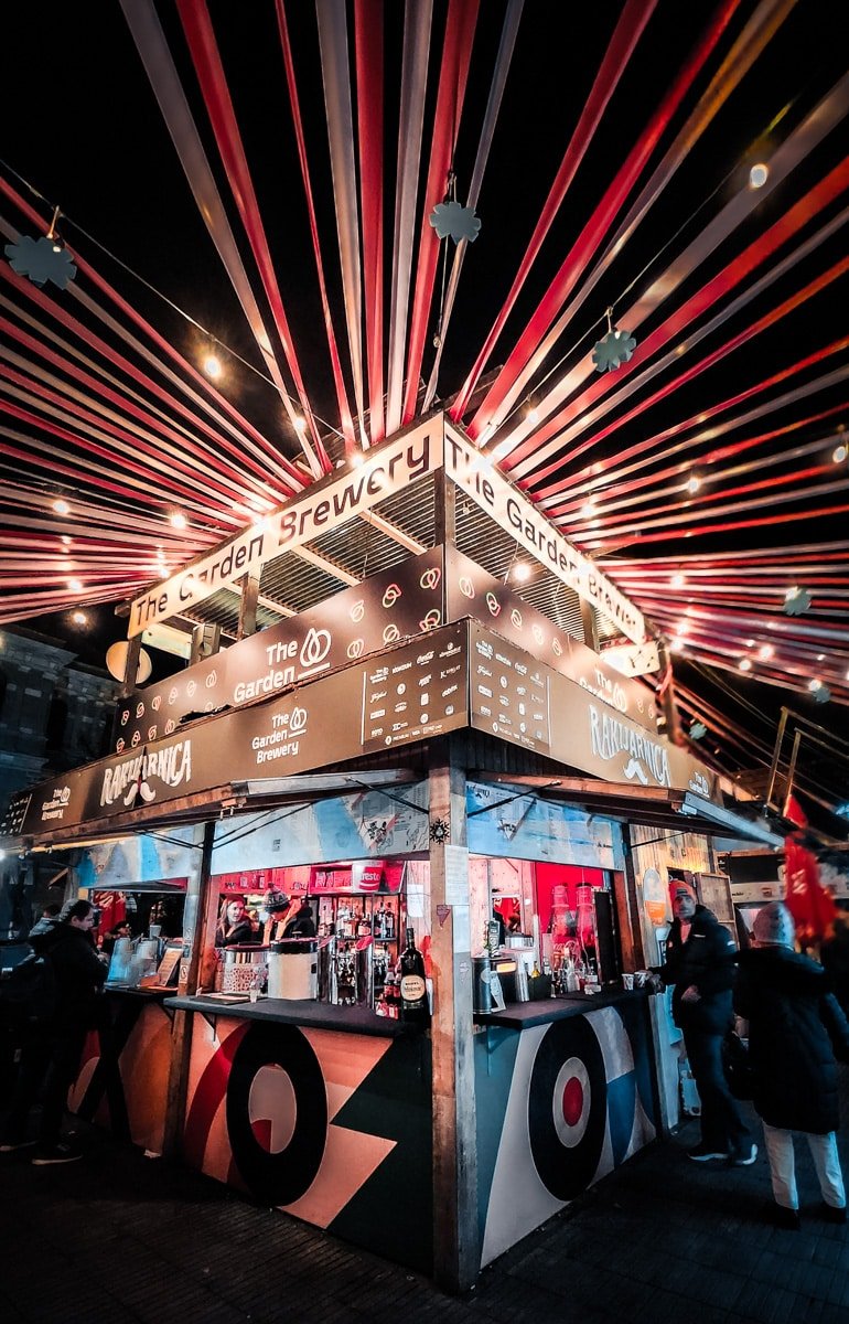 An Advent in Zagreb street food stall with red and white stripes.