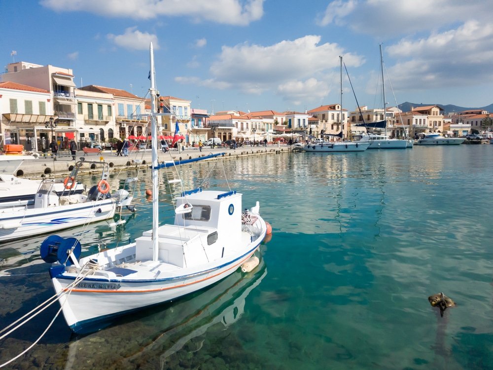 A boat docked in the water near Agistri, one of the Greek Saronic Islands.