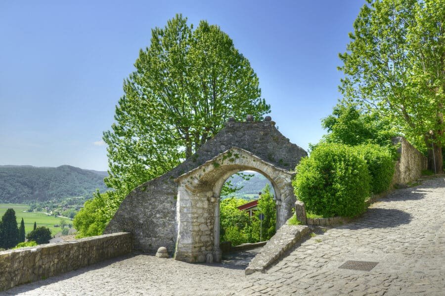 The Large Gate (Vela Vrata) in the wine capital of Buzet is surrounded by cobblestone paths, with a stunning stone archway welcoming visitors to this magical Istria guide.