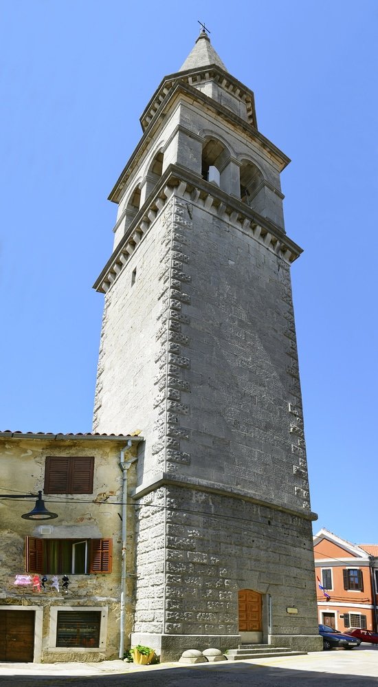 The bell Tower of Buzet - stone tower, reminiscent of the architecture found in Istria, proudly stands tall in the charming town of Buzet. The tower's defining feature is its meticulously crafted clock, adding