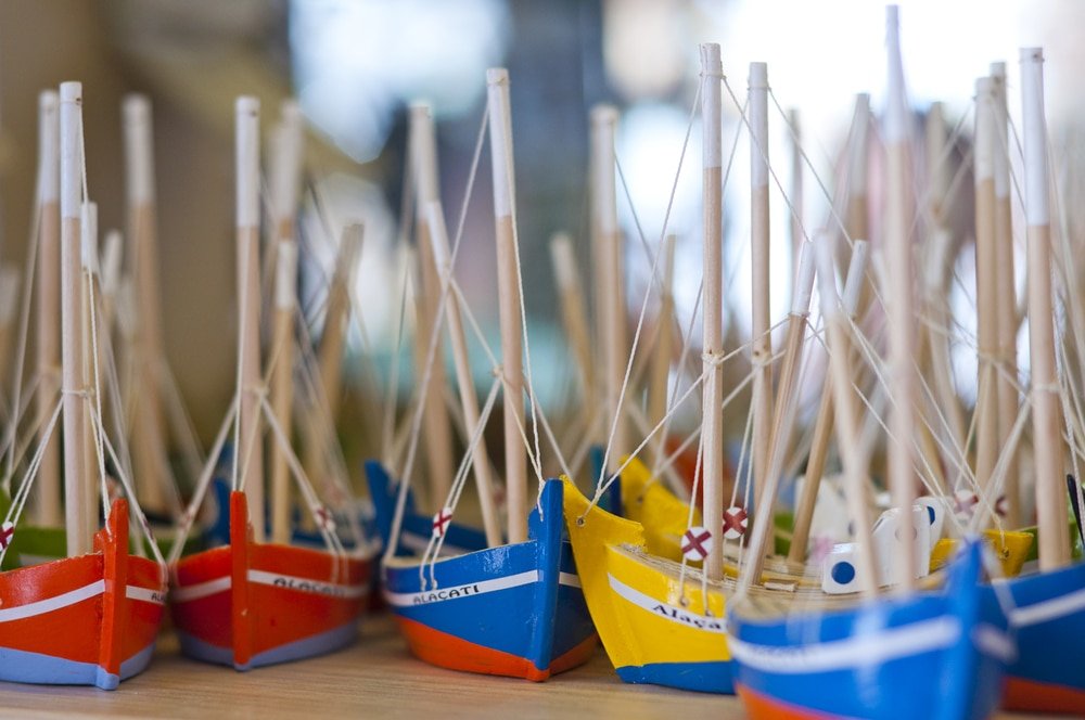 A row of small boats on a table in Alacati, Turkey.
