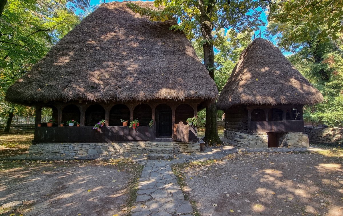 Two houses with thatched roofs in the Dimitrie Gusti National Village Museum