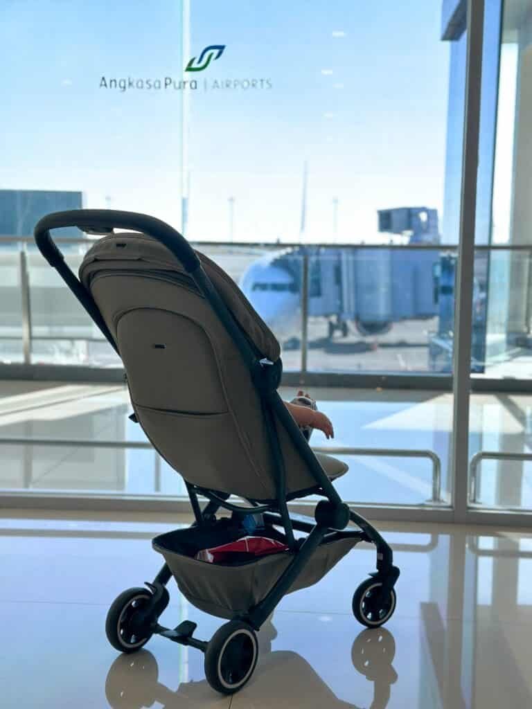 A Long Haul Flight With A Baby - baby in pram at airport