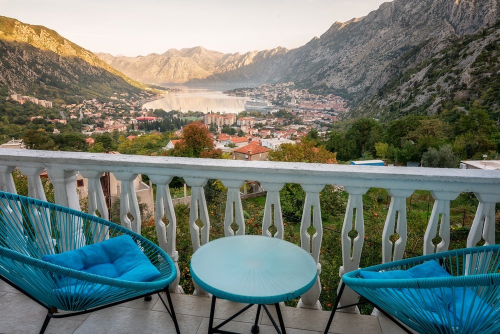 Two blue chairs on a balcony overlooking the Bay Of Kotor, Montenegro 