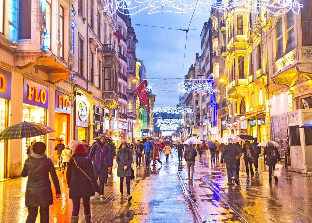 Istiklal Caddesi, Istanbul. Locals walking on a rainy night in January 