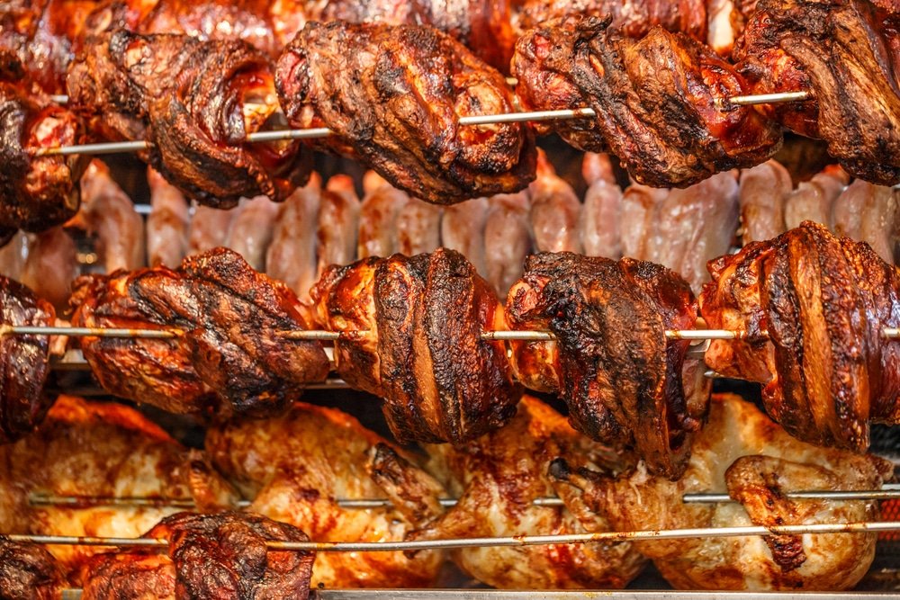 Find street food in Athens with mouthwatering meat on skewers cooked in a large oven - Kontosouvli