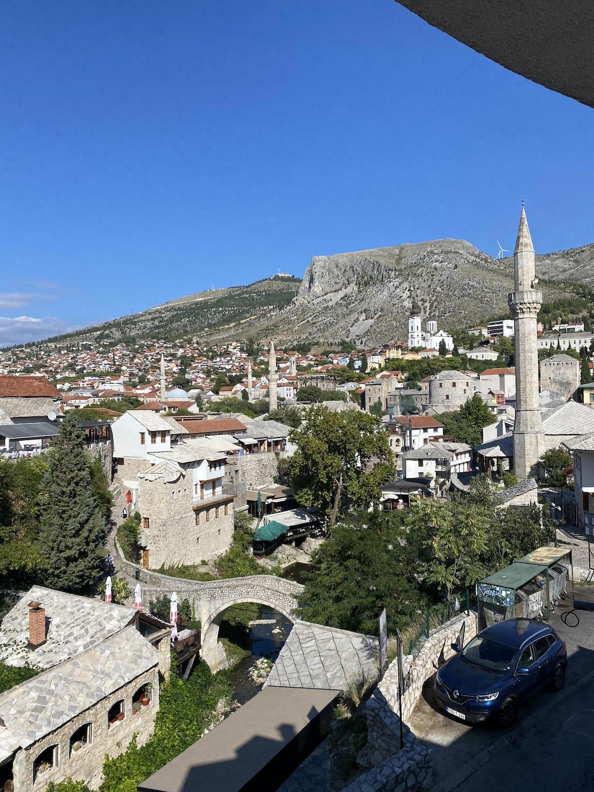 A breathtaking cityscape seen from a balcony, offering picturesque views during day trips from Dubrovnik to Mostar.
