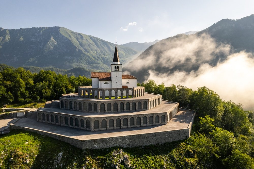 Drone view of St Anton Church and Kobarid Ossuary in Slovenia. Caporetto Memorial from First World War.