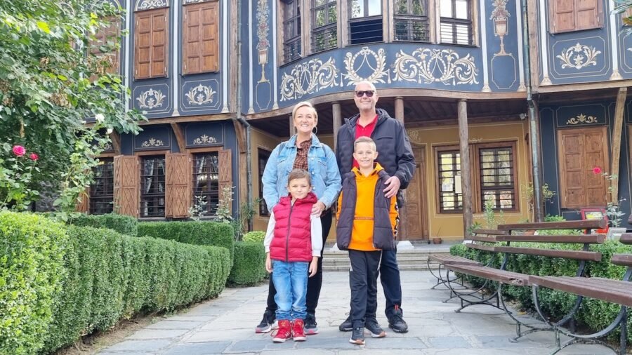 SJ & family posing for a picture in front of the Regional Ethnographic Museum Plovdiv - one of the things to do in Plovdiv.