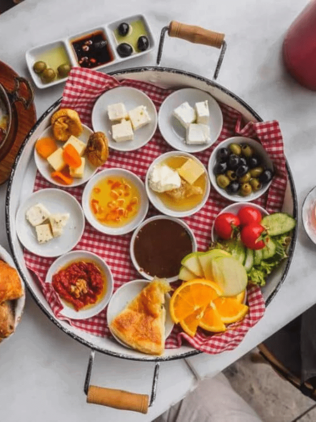 A tray full of traditional Turkish breakfast dishes on a table.