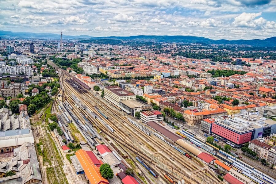 An aerial view of Zagreb packed with trains and tracks and buildings - Split to Zagreb train