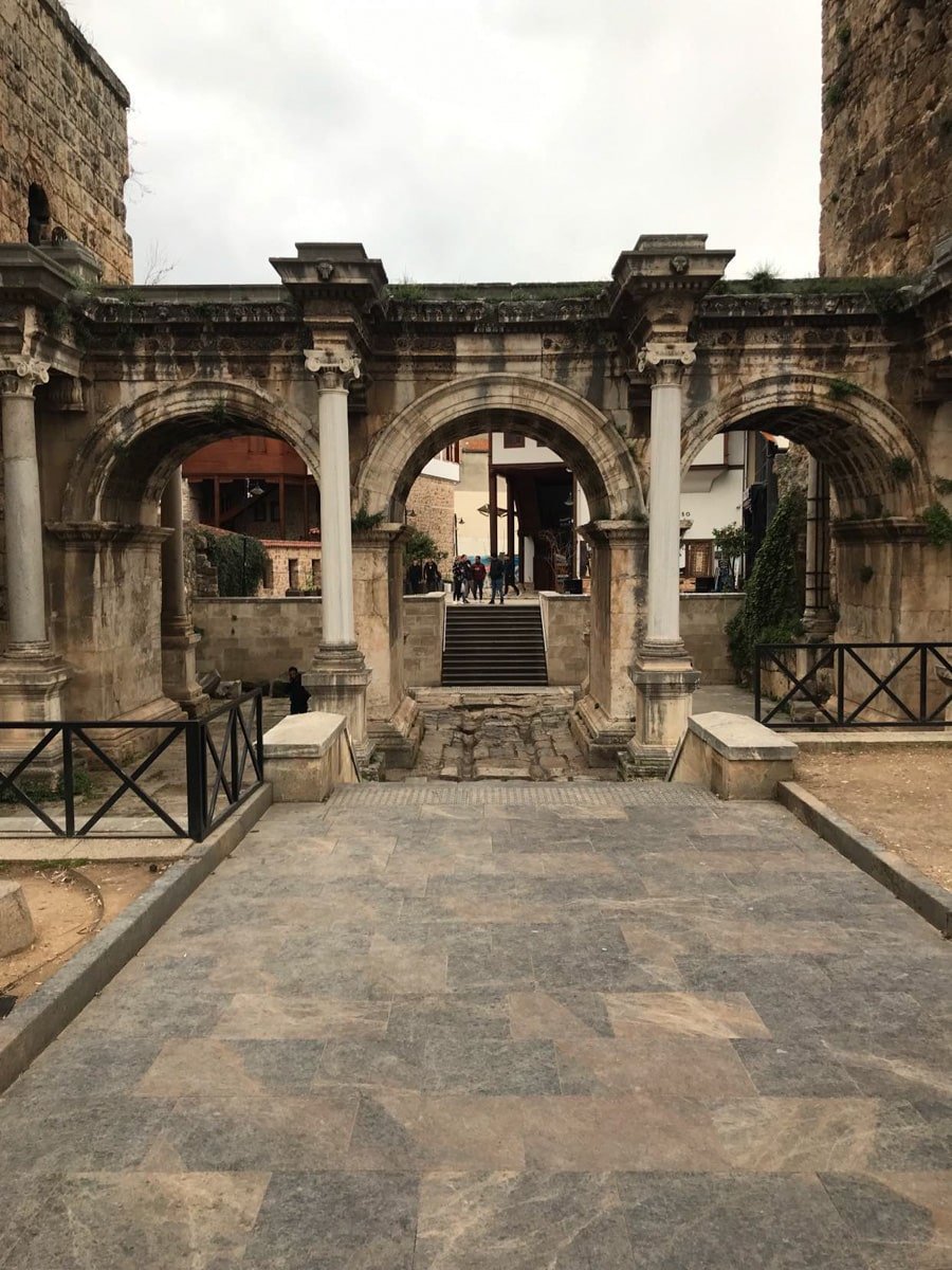Hadrian’s gate Antalya leading to a courtyard in a city.