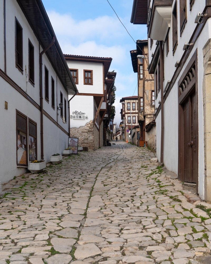 A cobblestone street in a historical city of Safranbolu - Historical Places In Turkey I Love Türkiye.