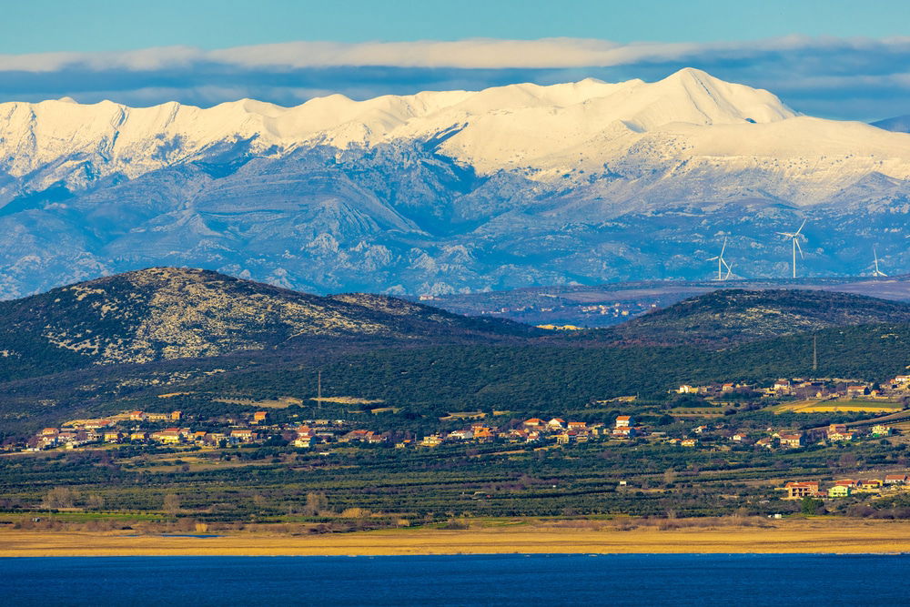 Snow-capped mountains in the distance during Croatia Winter.