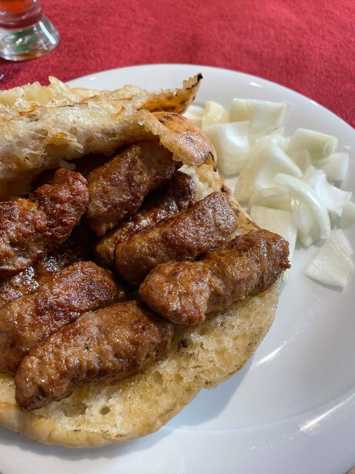 A plate of cevapi and onions, common in Croatia.
