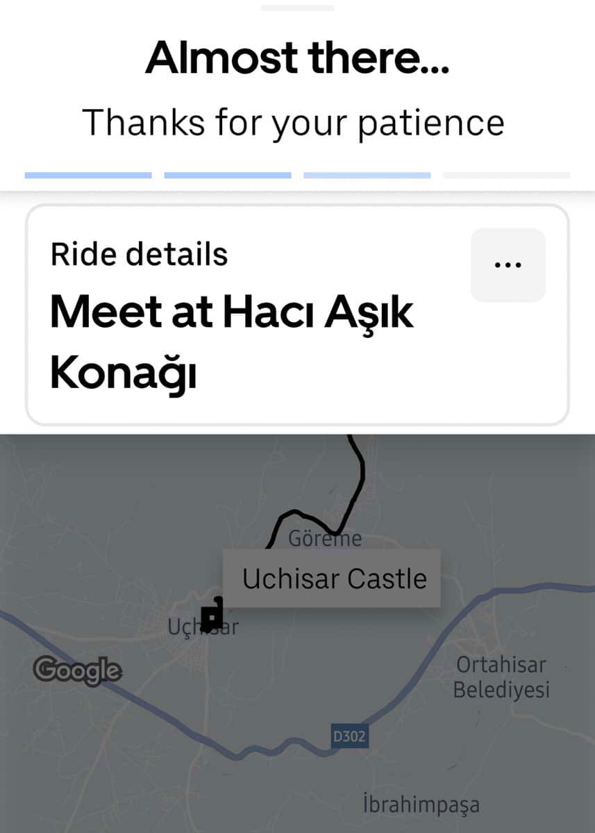 Screenshot of a ride-sharing app interface showing a map and destination labeled "meet at hacı aşık konağı" near Göreme and Uchisar Castle in Turkey.