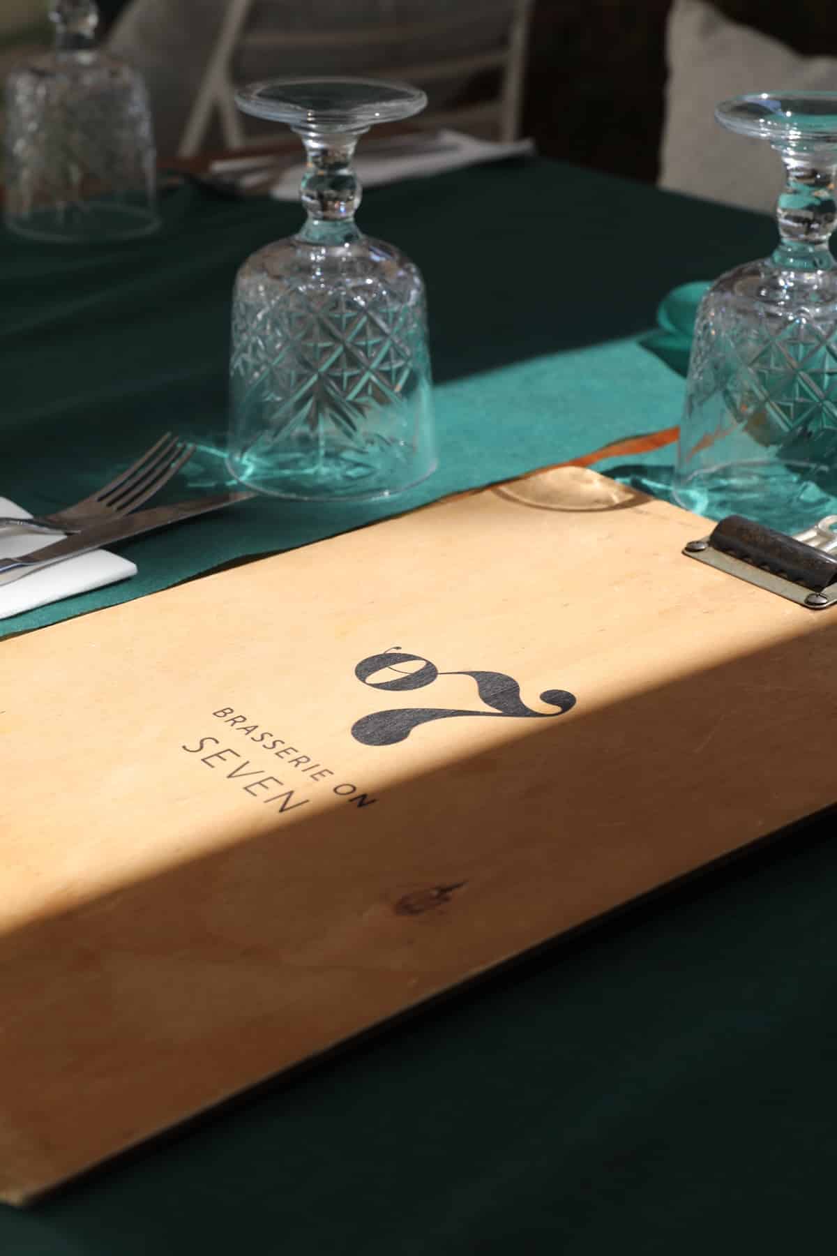 A wooden menu with the text 