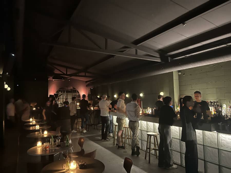 In the heart of Belgrade, this dimly lit bar showcases the essence of Belgrade nightlife. Patrons gather around the counter, immersed in vibrant conversation, while candlelit tables create an inviting atmosphere for those seeking unforgettable places to party.